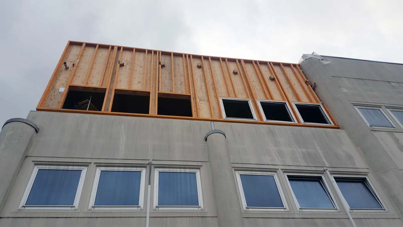 Sopraelevazione in legno di un edificio industriale a Pisa - Legnofab